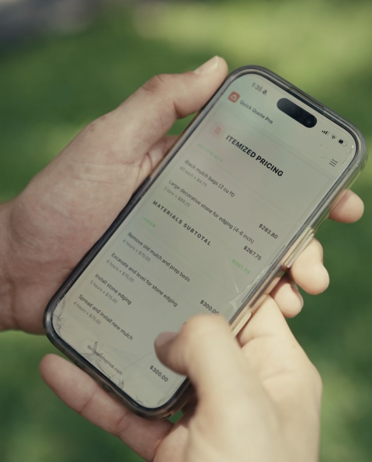 A phone showing the itemized pricing of a Quick Quote Pro proposal on the job site